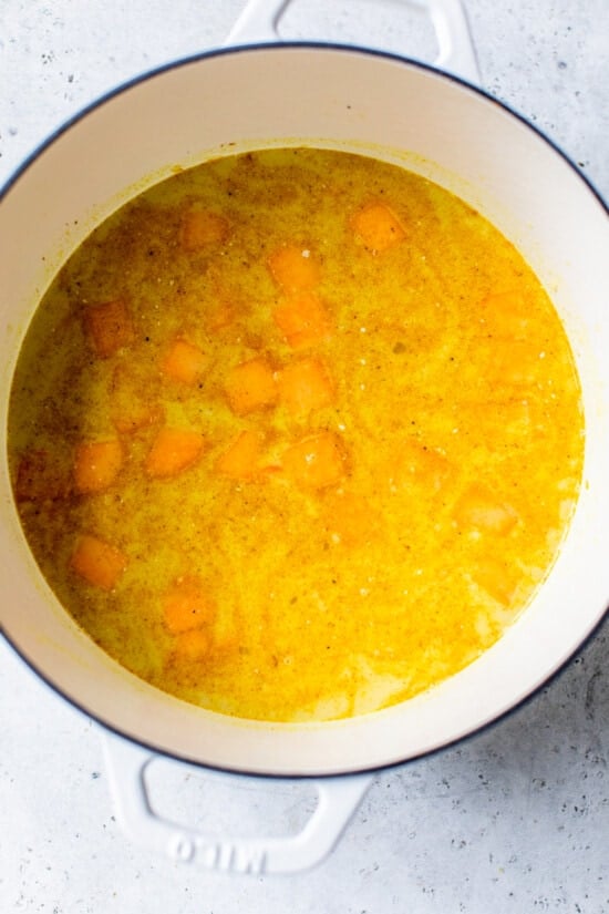 This Butternut Squash Soup is made with coconut milk, curry, and Indian spices which perfectly compliment the flavor of the butternut squash. butternut cooked in soup