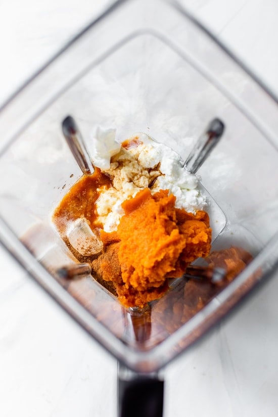 Pumpkin smoothie ingredients in a blender