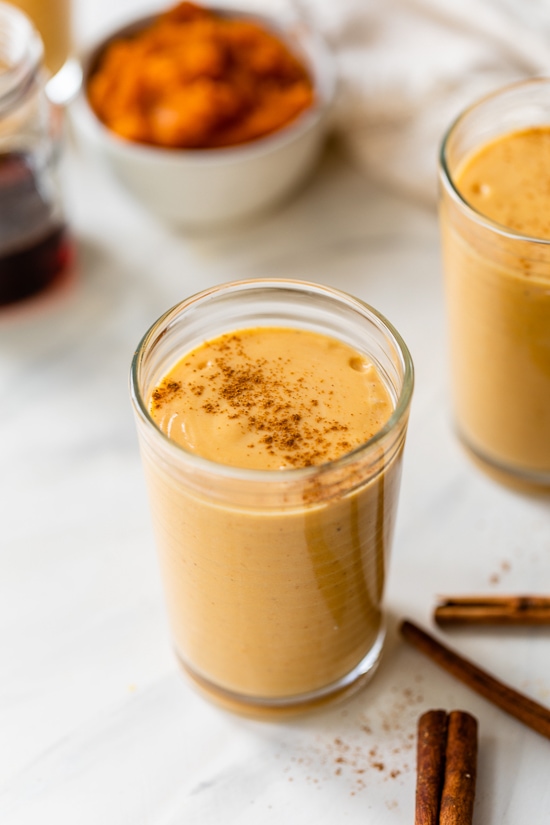 A pumpkin pie smoothie in a glass