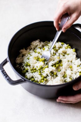 fluffing rice with a fork