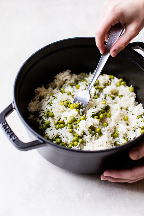 fluffing rice with a fork