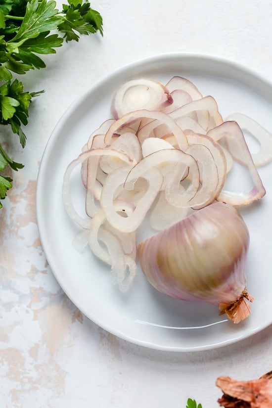 I lightened up this popular French chicken dish known as Poulet Au Vinaigre, which is made with chicken thighs and shallots cooked in red wine vinegar and white wine.