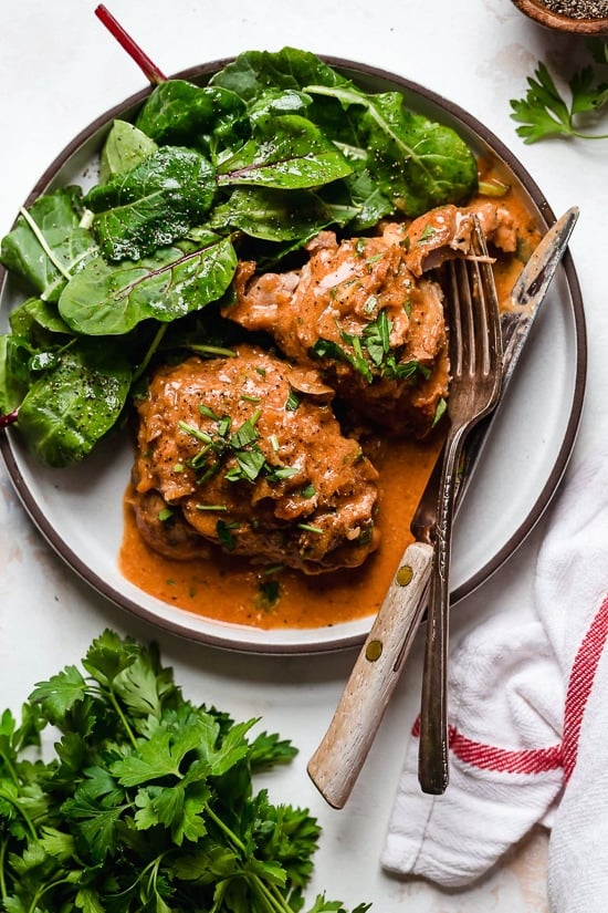 I lightened up this popular French chicken dish known as Poulet Au Vinaigre, which is made with chicken thighs and shallots cooked in red wine vinegar and white wine.