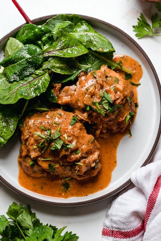I lightened up this popular French chicken dish known as Poulet Au Vinaigre, which is made with chicken thighs and shallots cooked in red wine vinegar and white wine.