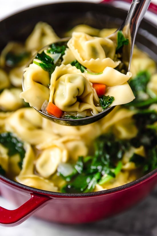 Spinach Tortellini en Brodo (in broth) is an Italian soup made with spinach and cheese tortellini and vegetables in a light broth.