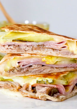 I made my favorite Cuban sandwich into a quesadilla filled with roast pork (pernil), ham, Swiss cheese, pickles, and mustard! Perfect for a quick lunch and a great way to use up my Slow Cooker Pernil.
