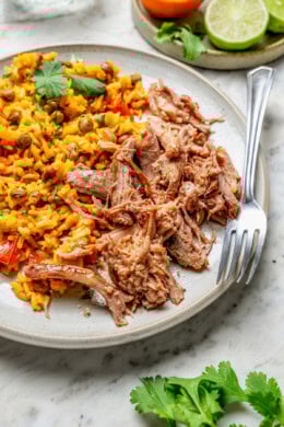 Pernil recipe on plate with rice