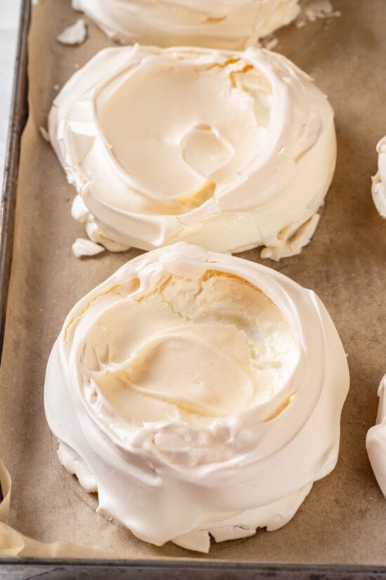 Pavlova is an elegant, light dessert that pairs airy meringue nests with whipped cream and fresh fruit. It's almost too pretty to eat! Meringue nests for pavlova