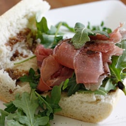 This prosciutto di Parma, peppery arugula, sweet balsamic and heart healthy olive oil on french bread is a winning combination.