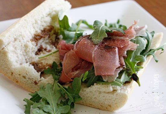 This prosciutto di Parma, peppery arugula, sweet balsamic and heart healthy olive oil on french bread is a winning combination.