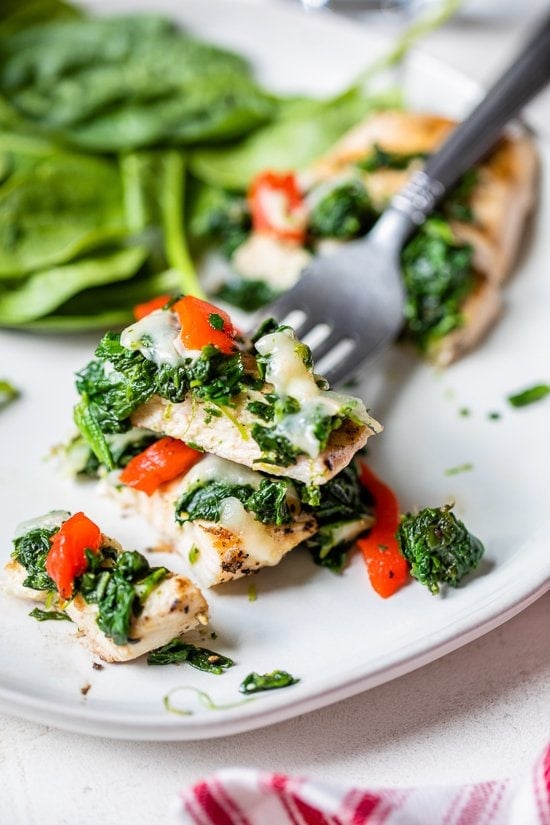 Grilled Chicken with Spinach and Melted Mozzarella on a fork