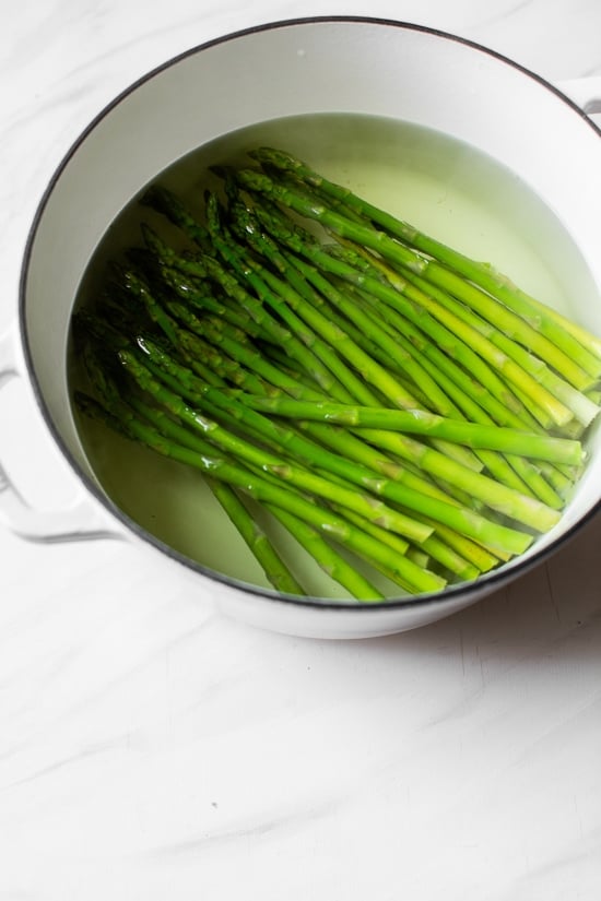 Baby Pasta Shells with Asparagus and Marinara Sauce is a quick and easy 4-ingredient pasta dish, perfect for Spring. Ready in under 15 minutes and under ten dollars to make.