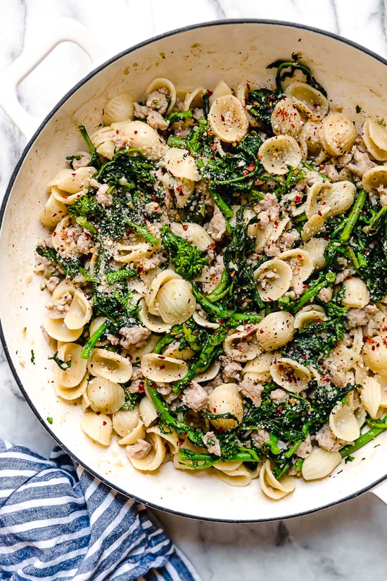 Orecchiette Pasta with Sausage and Broccoli Rabe uses chicken sausage in place of pork and a whole lot of garlic! This lightened up version will not disappoint!!
