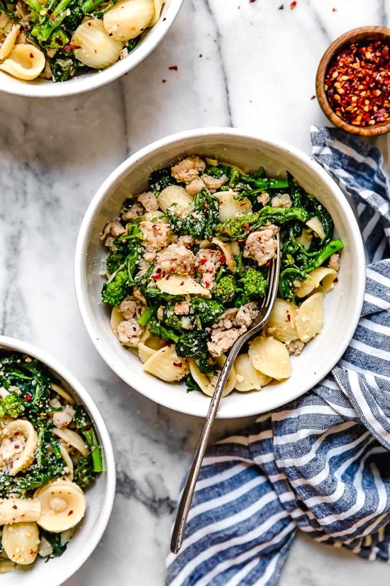 Orecchiette Pasta with Sausage and Broccoli Rabe uses chicken sausage in place of pork and a whole lot of garlic! This lightened up version will not disappoint!!