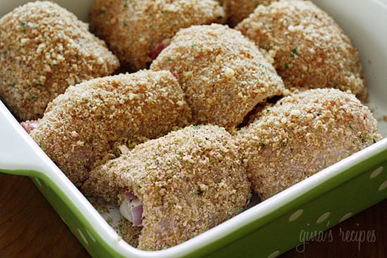 Chicken cutlets dipped in lemon and olive oil, gently coated in a combination of bread crumbs and romano cheese then rolled with prosciutto, cheese and red onion and baked until golden.