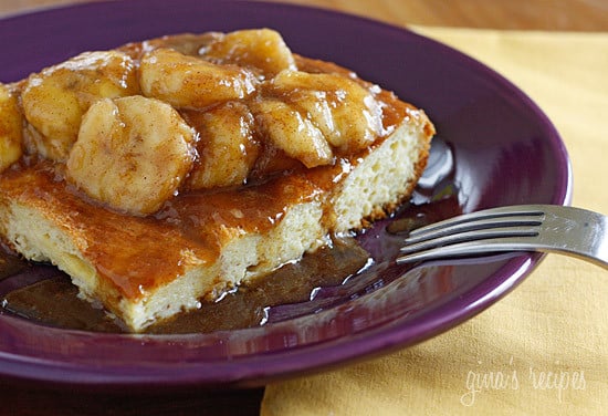 Plate of french toast with sliced bananas foster topping