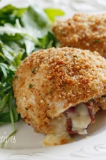 Chicken cutlets dipped in lemon and olive oil, gently coated in a combination of bread crumbs and romano cheese then rolled with prosciutto, cheese and red onion and baked until golden.