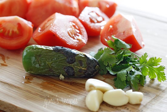 This spicy red salsa is made with fresh tomatoes, roasted jalapeño, garlic and cilantro, pureed in a blender then simmered until the tomatoes deepen in color.