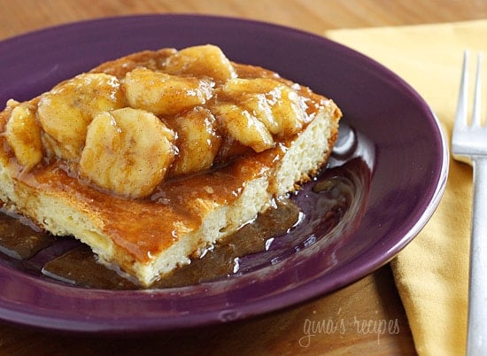 Plate of french toast with sliced bananas foster topping