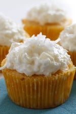 Pineapple and coconut top these light pineapple cupcakes, what a perfect Spring dessert! For the coconut lover out there, these are super easy, low fat, moist and delicious!