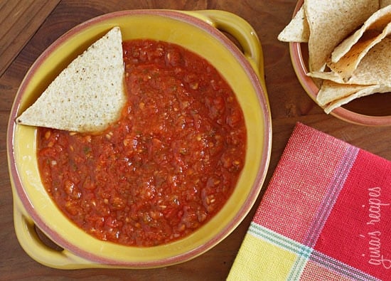 This spicy red salsa is made with fresh tomatoes, roasted jalapeño, garlic and cilantro, pureed in a blender then simmered until the tomatoes deepen in color. Serve with your favorite baked chips and Sinless Margaritas!