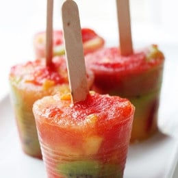 Freezing fresh fruit with a splash of juice makes for a fresh and healthy snack. Use whatever fruit you're heart desires. A perfect summer treat!