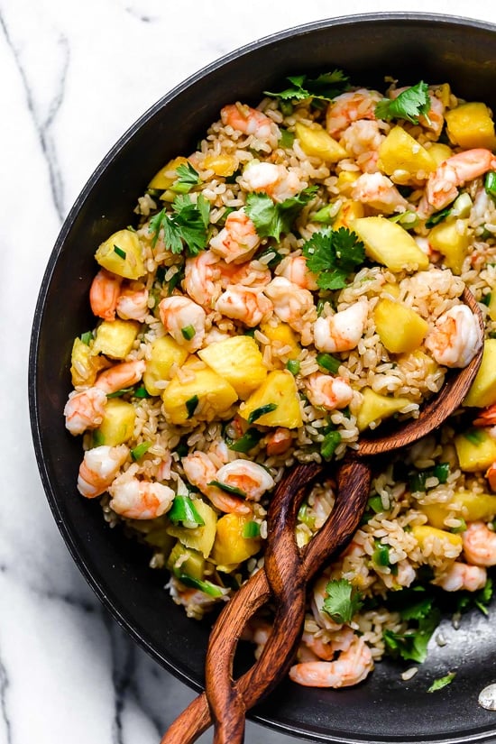 Pineapple Shrimp Fried Rice has a delicious flavor combination of savory, sweet and spicy. Serve it in hollowed out pineapples for a beautiful presentation!