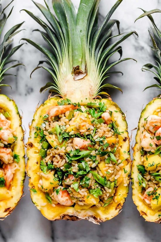 Pineapple Shrimp Fried Rice has a delicious flavor combination of savory, sweet and spicy. Serve it in hollowed out pineapples for a beautiful presentation!