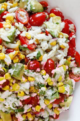 A wonderful summer salad made with lump crab meat, summer tomatoes, sweet charred roasted corn, cilantro, hot peppers and zesty lime juice. Serve this over mixed greens or tostadas as a main dish or you can put this in martini glasses as a fancy appetizer.