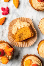 Overhead view of pumpkin cupcake on cupcake wrapper