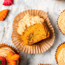 Overhead view of pumpkin cupcake on cupcake wrapper