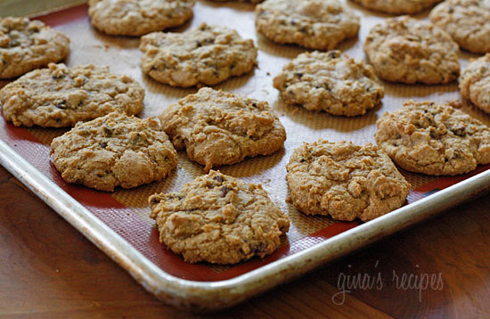 Made with pumpkin puree, pumpkin pie spice, and mini chocolate chips these Pumpkin Spice Cookies are soft, chewy, and dotted with chocolatey goodness. Ready in less than 30 minutes! Pumpkin spice cookies on a baking sheet