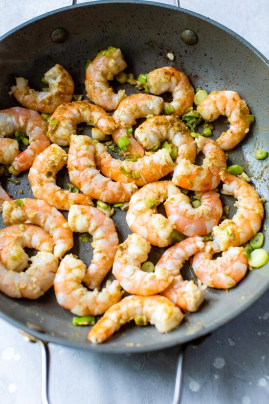 Skillet with shrimp.