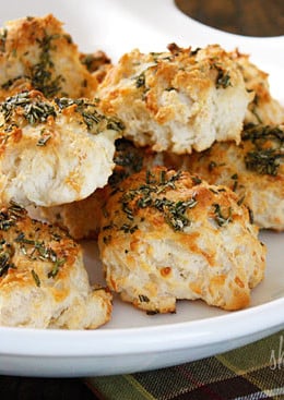 The scent of Garlic + Rosemary + Baked Bread is absolutely intoxicating to me. Seriously, my stomach starts to growl just thinking about it. I've always been more of a savory girl; I can bake a dozen cupcakes and not eat one, but place a batch of these biscuits in front of me... different story.
