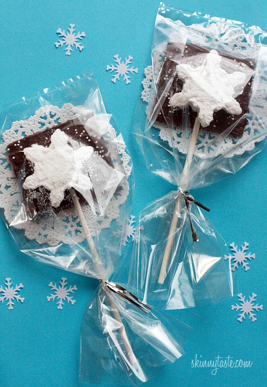 Smores Pops – Chocolate graham crackers coated with melted chocolate and marshmallows on a stick. A fabulous winter treat whether you want to make them as favors or just have fun making them with the kids.