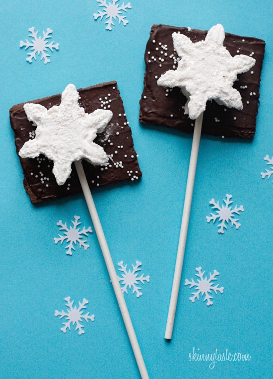 Smores Pops – Chocolate graham crackers coated with melted chocolate and marshmallows on a stick. A fabulous winter treat whether you want to make them as favors or just have fun making them with the kids.