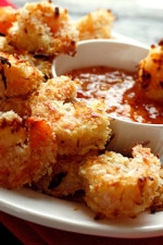 These Easy Baked Coconut Shrimp are crisp, golden and delicious served a sweet and spicy apricot dipping sauce. Set these out on a platter in front of some hungry guests and I guarantee they will disappear!!
