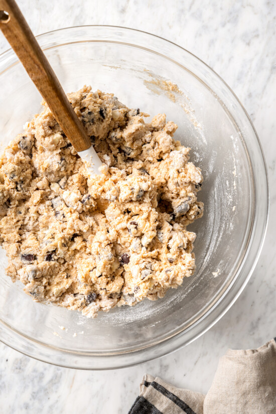 Chocolate chip scones are sweetened to perfection and studded with chocolate chips to make them taste like a treat. An easy no-fail recipe! Overhead view of dough for chocolate chip scones in mixing bowl