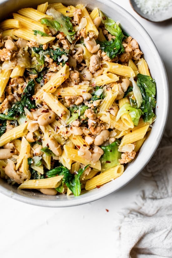 Pasta with Italian Chicken Sausage, Escarole and Beans is ridiculously good made with lots of garlic, lean Italian chicken sausage, and white cannellini beans.