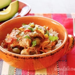 Chicken a la Criolla, a simple yet flavorful Latin dish made with stewed boneless skinless chicken thighs bell peppers, onions, garlic, tomatoes, olives, cilantro and spices. Slow cooker or Instant Pot directions provided.