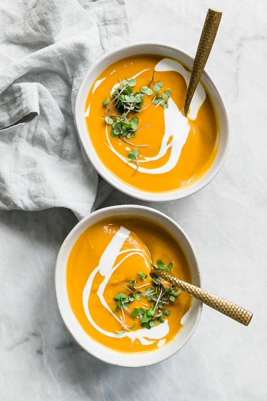 This healthy Carrot Ginger Soup is made with fresh carrots, a hint of fresh ginger and a touch of sour cream blended together until creamy, perfect for lunch or dinner. You can make it vegan or dairy-free by swapping the cream for coconut milk.