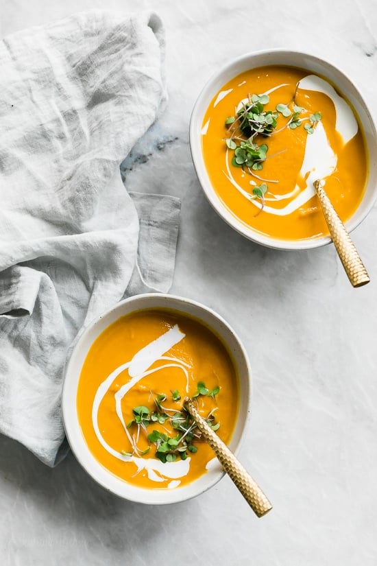This healthy Carrot Ginger Soup is made with fresh carrots, a hint of fresh ginger and a touch of sour cream blended together until creamy, perfect for lunch or dinner. You can make it vegan or dairy-free by swapping the cream for coconut milk.