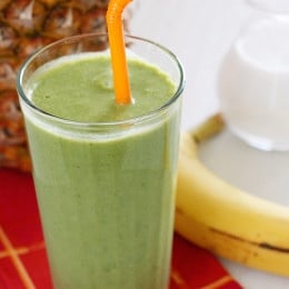 A skinny tropical green smoothie made with pineapple, shredded coconut and bananas, then blended with spinach, light coconut milk and Greek yogurt. High in Vitamin A, B-6, C, Manganese and fiber.