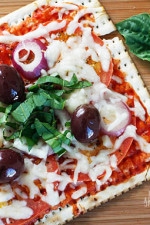 A matzo cracker makes a great base for a pizza that kids and adults will love for Passover! Top it with your favorite vegetables and cheese and you have yourself a quick meal.