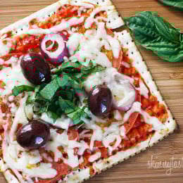 A matzo cracker makes a great base for a pizza that kids and adults will love for Passover! Top it with your favorite vegetables and cheese and you have yourself a quick meal.