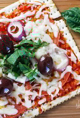 A matzo cracker makes a great base for a pizza that kids and adults will love for Passover! Top it with your favorite vegetables and cheese and you have yourself a quick meal.