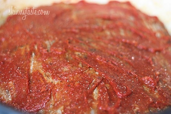 This braised brisket recipe is slow cooked in the oven with potatoes, carrots and onions. Slicing it half-way through makes it extra tender! Brisket with tomato paste.