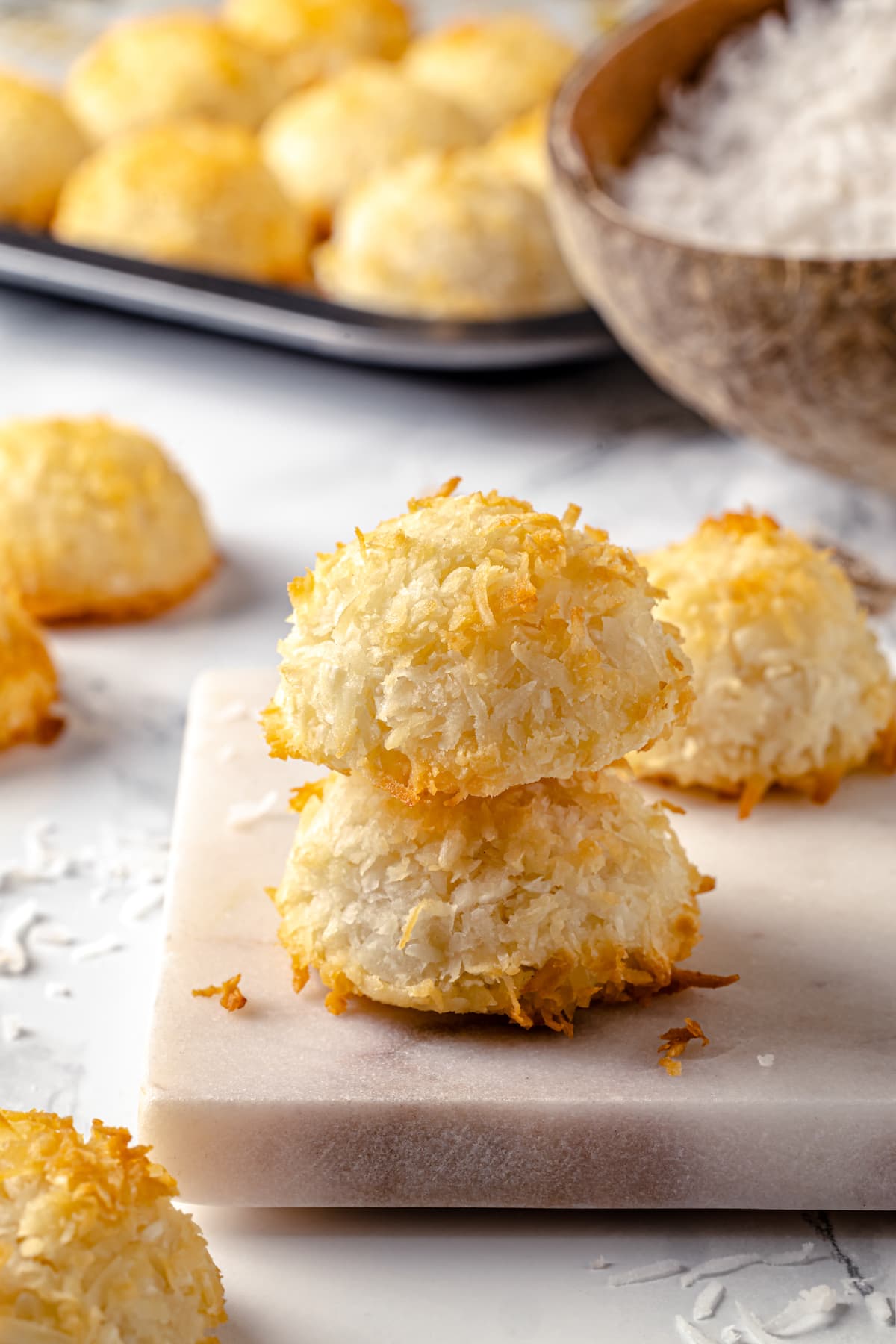 Made with sweetened coconut flakes, egg whites, and just a few other ingredients, Coconut Macaroons are moist, chewy, and perfectly flavored. Two coconut macaroons stacked on each other
