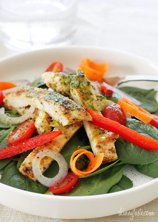 Chicken marinaded with lemon, garlic and oregano, then grilled to perfection and served over a colorful spinach salad. Topped with a white balsamic vinaigrette, does it get better than that?