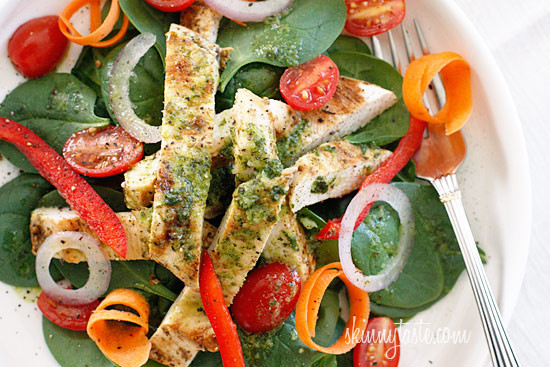 Chicken marinaded with lemon, garlic and oregano, then grilled to perfection and served over a colorful spinach salad. Topped with a white balsamic vinaigrette, does it get better than that?